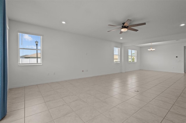 12697 Achasta Blvd, Hudson, FL 34669 - spare room featuring a ceiling fan, recessed lighting, a chandelier, and light tile patterned floors