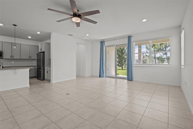 12697 Achasta Blvd, Hudson, FL 34669 - unfurnished living room featuring recessed lighting, ceiling fan, baseboards, and light tile patterned floors