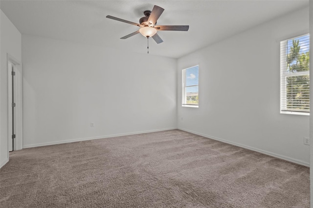 12697 Achasta Blvd, Hudson, FL 34669 - carpeted empty room with plenty of natural light, ceiling fan, and baseboards