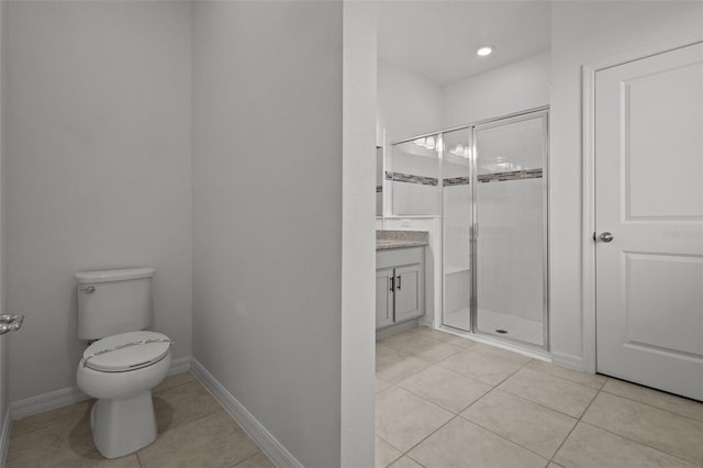 12697 Achasta Blvd, Hudson, FL 34669 - bathroom with tile patterned floors, a shower stall, toilet, vanity, and baseboards