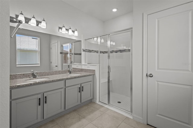 12697 Achasta Blvd, Hudson, FL 34669 - full bathroom with a shower stall, double vanity, tile patterned flooring, and recessed lighting