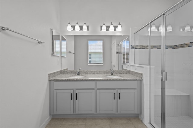 12697 Achasta Blvd, Hudson, FL 34669 - full bathroom featuring a stall shower, double vanity, and tile patterned floors
