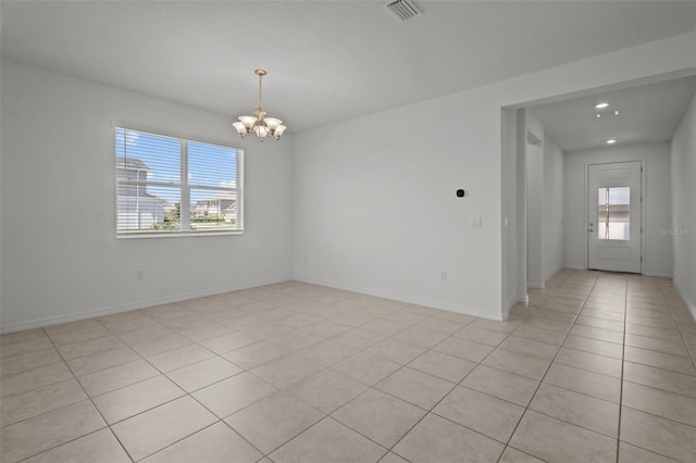 12697 Achasta Blvd, Hudson, FL 34669 - spare room with a chandelier, light tile patterned floors, recessed lighting, and baseboards