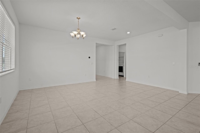 12697 Achasta Blvd, Hudson, FL 34669 - spare room featuring a chandelier, recessed lighting, baseboards, and light tile patterned floors