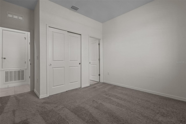 12697 Achasta Blvd, Hudson, FL 34669 - unfurnished bedroom with carpet, baseboards, and a closet