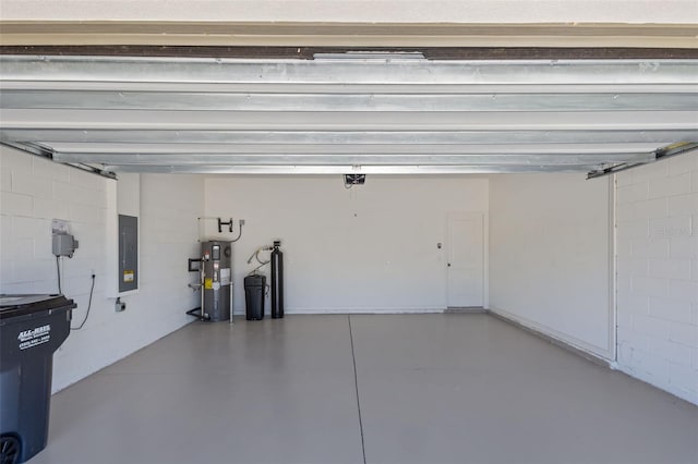 12697 Achasta Blvd, Hudson, FL 34669 - garage with hybrid water heater, electric panel, a garage door opener, and concrete block wall