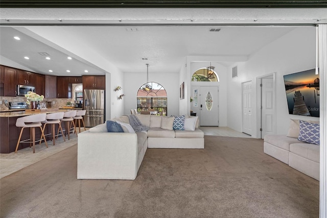 12470 93rd St, Largo, FL 33773 - living room featuring light carpet and recessed lighting