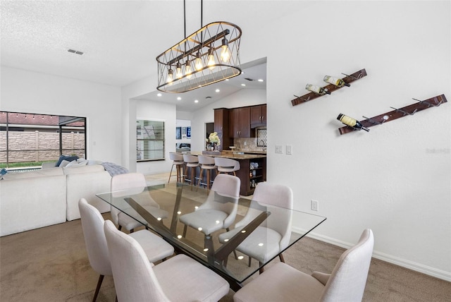 12470 93rd St, Largo, FL 33773 - dining space featuring light colored carpet, recessed lighting, baseboards, and a chandelier