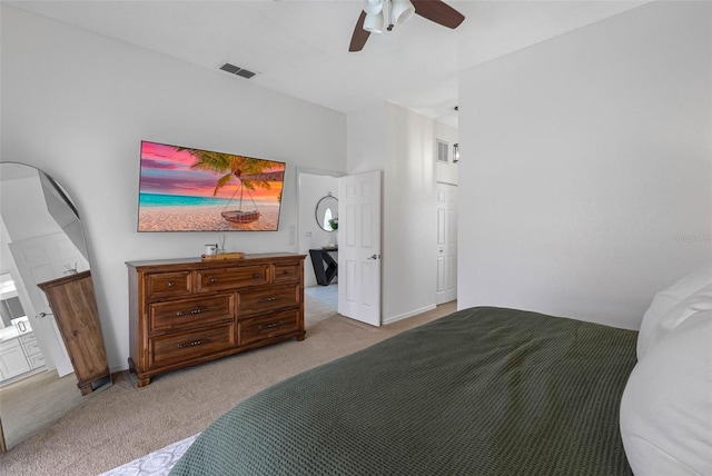12470 93rd St, Largo, FL 33773 - bedroom with light colored carpet and a ceiling fan