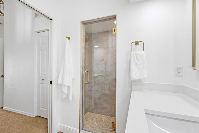 12470 93rd St, Largo, FL 33773 - bathroom with a shower stall and baseboards