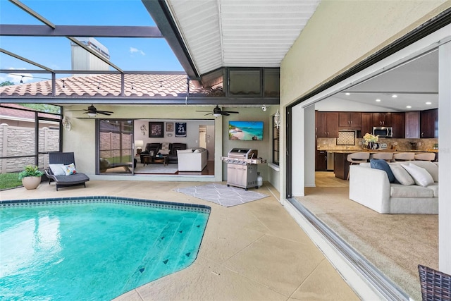 12470 93rd St, Largo, FL 33773 - swimming pool featuring a ceiling fan, a patio area, and a lanai