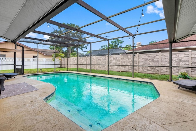 12470 93rd St, Largo, FL 33773 - view of swimming pool featuring a patio, a fenced backyard, and glass enclosure