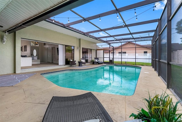 12470 93rd St, Largo, FL 33773 - view of swimming pool with a patio area and glass enclosure