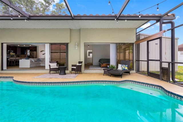 12470 93rd St, Largo, FL 33773 - swimming pool with outdoor lounge area, a patio, and glass enclosure