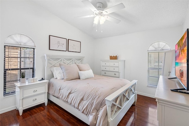 12470 93rd St, Largo, FL 33773 - bedroom featuring dark wood-style floors, baseboards, vaulted ceiling, and ceiling fan