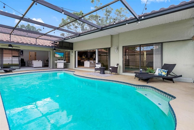 12470 93rd St, Largo, FL 33773 - outdoor pool featuring ceiling fan, a patio area, grilling area, and a lanai