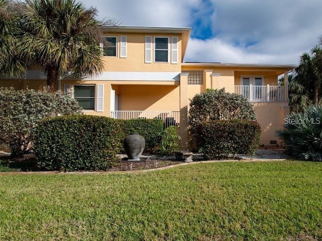 101 8th St, Belleair Beach, FL 33786 - view of front of property featuring stucco siding and a front yard