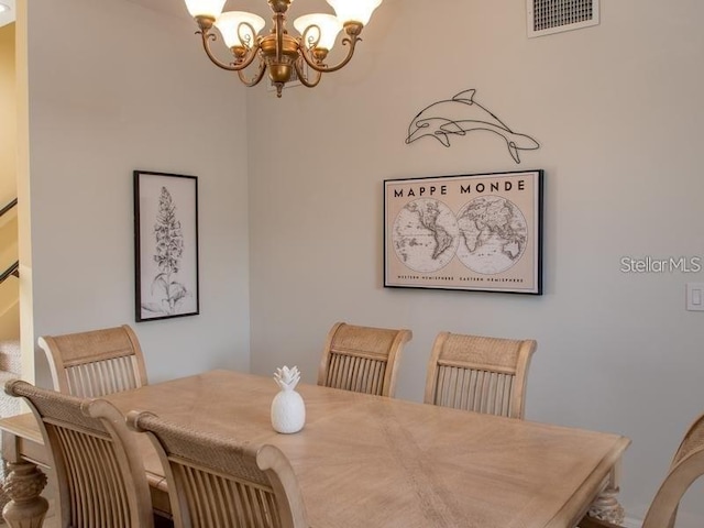 101 8th St, Belleair Beach, FL 33786 - dining room with a chandelier