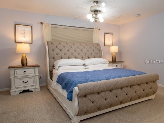 101 8th St, Belleair Beach, FL 33786 - bedroom with carpet, baseboards, and ceiling fan