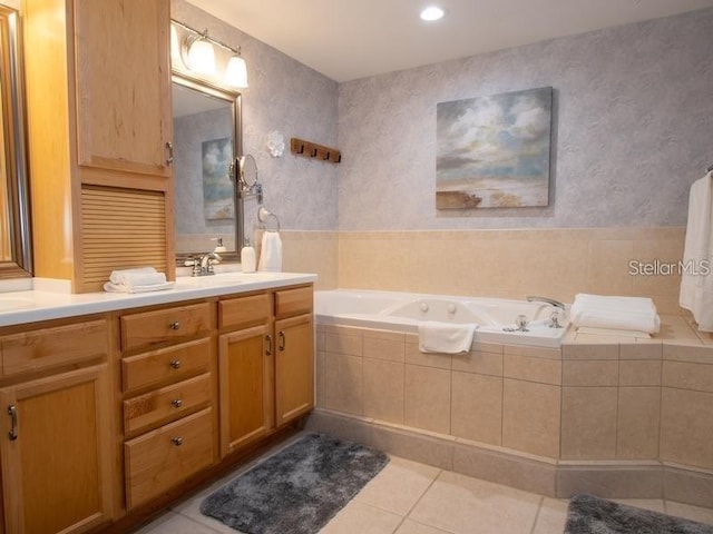101 8th St, Belleair Beach, FL 33786 - full bathroom featuring tile patterned floors, double vanity, a bath, wallpapered walls, and recessed lighting