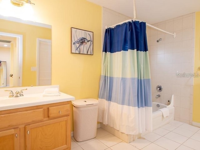 101 8th St, Belleair Beach, FL 33786 - full bathroom featuring vanity, tile patterned floors, and shower / bath combo with shower curtain
