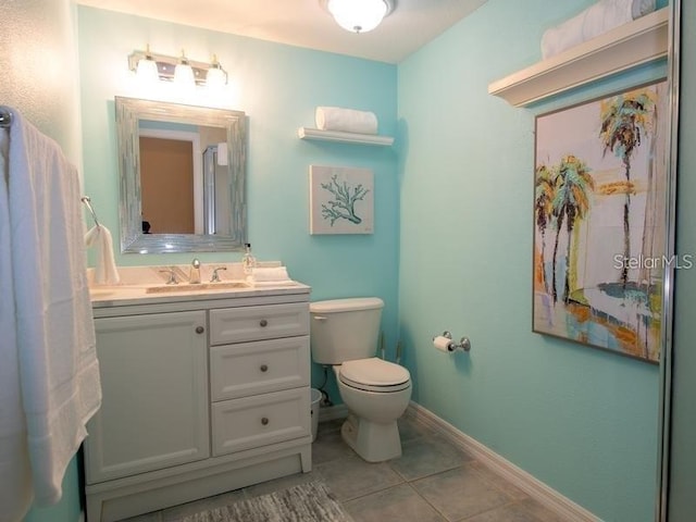 101 8th St, Belleair Beach, FL 33786 - bathroom with toilet, tile patterned flooring, vanity, and baseboards