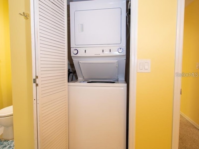 101 8th St, Belleair Beach, FL 33786 - laundry area featuring stacked washer and clothes dryer