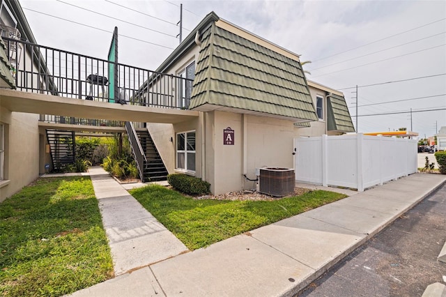 1799 N Highland Ave Unit 3, Clearwater, FL 33755 - view of property with central AC and stairs
