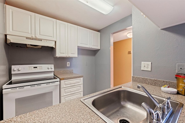 1799 N Highland Ave Unit 3, Clearwater, FL 33755 - kitchen featuring white electric range, under cabinet range hood, a sink, white cabinetry, and light countertops