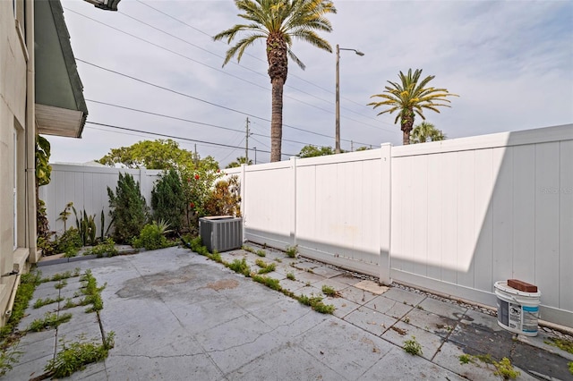 1799 N Highland Ave Unit 3, Clearwater, FL 33755 - fenced backyard featuring central AC unit and a patio
