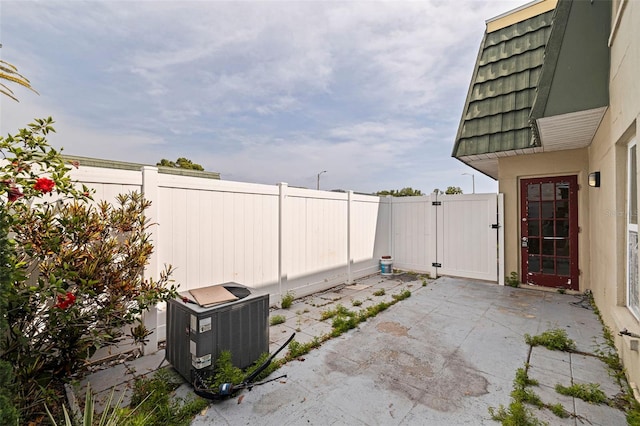 1799 N Highland Ave Unit 3, Clearwater, FL 33755 - fenced backyard featuring a patio, a gate, and central AC unit