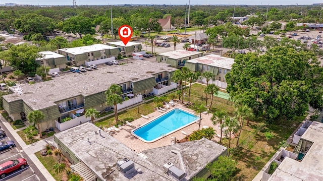 1799 N Highland Ave Unit 3, Clearwater, FL 33755 - drone / aerial view of a pool and a tree filled landscape