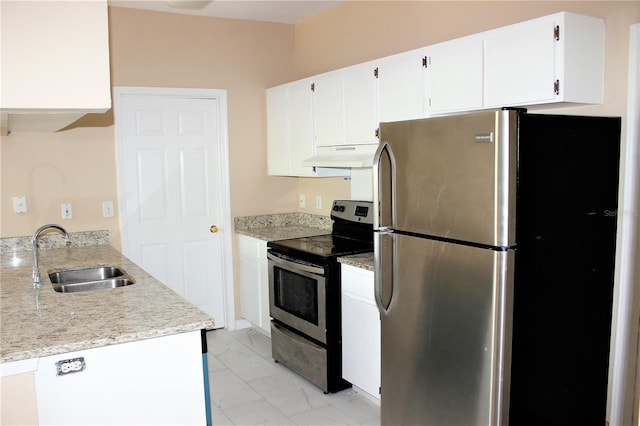 13235 Sanctuary Cove Dr Unit 201, Temple Terrace, FL 33637 - kitchen with appliances with stainless steel finishes, under cabinet range hood, light marble finish flooring, and white cabinetry