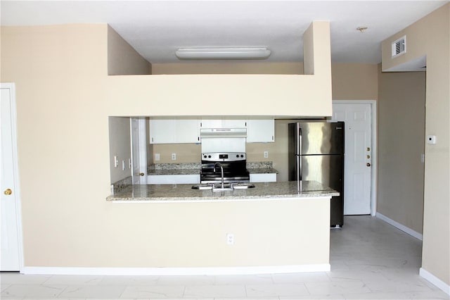 13235 Sanctuary Cove Dr Unit 201, Temple Terrace, FL 33637 - kitchen with appliances with stainless steel finishes, light marble finish floors, under cabinet range hood, a peninsula, and white cabinets