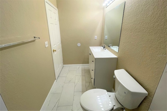 13235 Sanctuary Cove Dr Unit 201, Temple Terrace, FL 33637 - bathroom with marble finish floors, vanity, and a textured wall