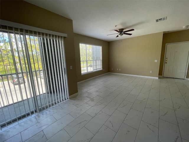13235 Sanctuary Cove Dr Unit 201, Temple Terrace, FL 33637 - empty room featuring marble look tiles and ceiling fan