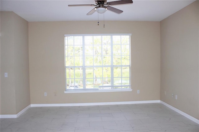 13235 Sanctuary Cove Dr Unit 201, Temple Terrace, FL 33637 - spare room with light marble finish floors and a ceiling fan