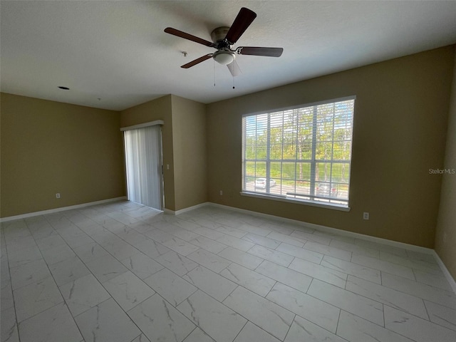 13235 Sanctuary Cove Dr Unit 201, Temple Terrace, FL 33637 - unfurnished room with light marble finish flooring and a ceiling fan