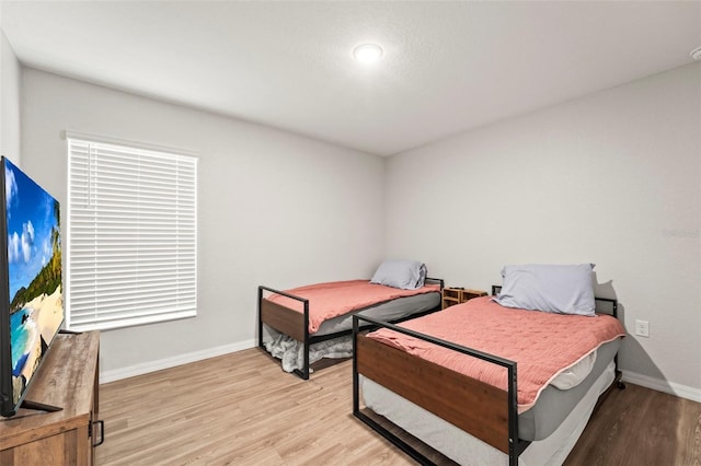 8009 N Primrose Dr, Citrus Springs, FL 34434 - bedroom featuring light wood-style floors and baseboards