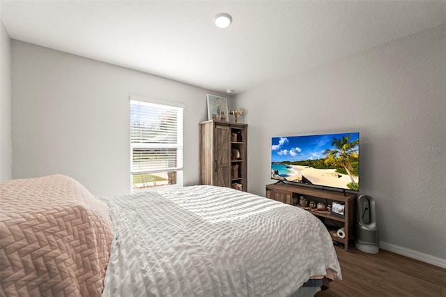 8009 N Primrose Dr, Citrus Springs, FL 34434 - bedroom featuring wood finished floors and baseboards