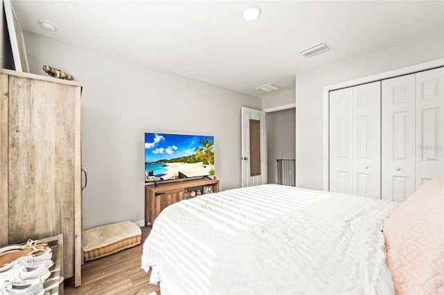 8009 N Primrose Dr, Citrus Springs, FL 34434 - bedroom featuring light wood-type flooring and a closet