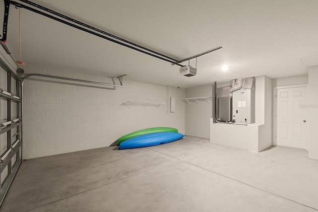 8009 N Primrose Dr, Citrus Springs, FL 34434 - garage with a garage door opener and concrete block wall