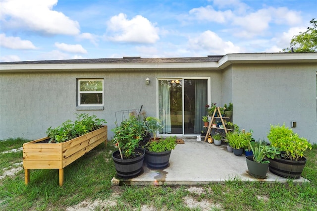8009 N Primrose Dr, Citrus Springs, FL 34434 - entrance to property with stucco siding and a patio