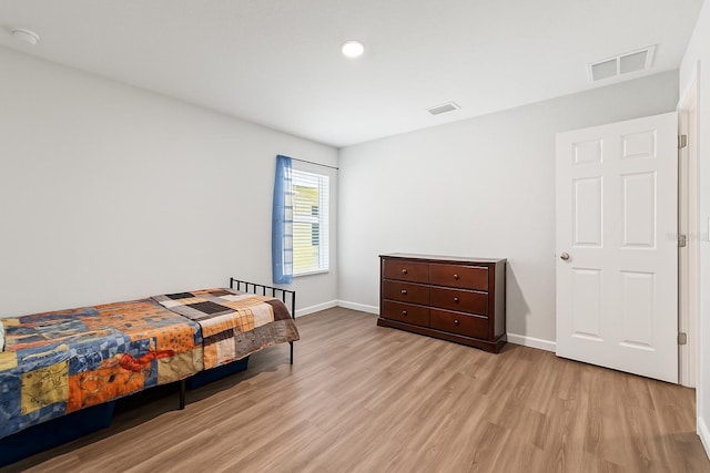 7839 N Quibble Ave, Citrus Springs, FL 34434 - bedroom featuring wood finished floors, baseboards, and recessed lighting