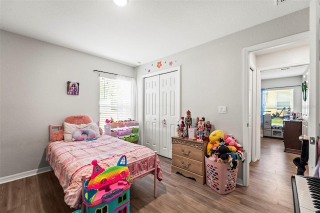 7839 N Quibble Ave, Citrus Springs, FL 34434 - bedroom with a closet, wood finished floors, and baseboards