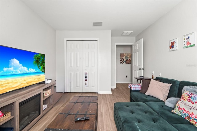 7839 N Quibble Ave, Citrus Springs, FL 34434 - living area featuring wood finished floors and baseboards