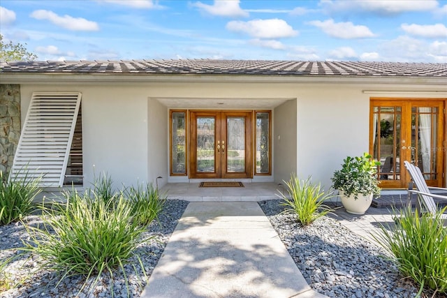 2900 Sandpiper Pl, Clearwater, FL 33762 - doorway to property with french doors and stucco siding