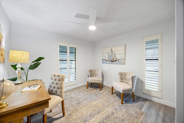 2900 Sandpiper Pl, Clearwater, FL 33762 - home office featuring ceiling fan, wood finished floors, and baseboards