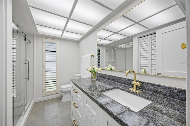 2900 Sandpiper Pl, Clearwater, FL 33762 - bathroom with vanity, a stall shower, toilet, baseboards, and tile patterned floors