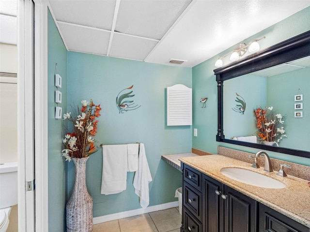 13500 Gulf Blvd Unit 506, Madeira Beach, FL 33708 - bathroom featuring toilet, vanity, tile patterned flooring, and baseboards
